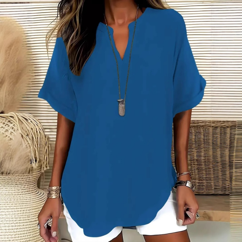 Blusa de manga corta holgada de color liso a la moda.
